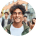 Smiling person in urban setting.
