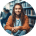 Smiling person in urban outdoor setting.